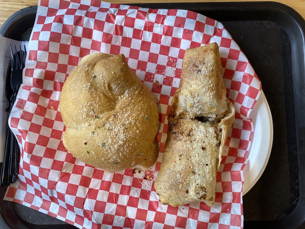 This
      is Italian flatbread stuffed with sausage and a garlic knot.