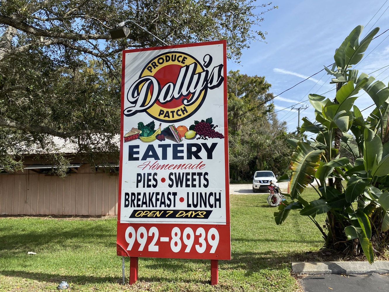This is the sign for Dolly's Produce Patch & Eatery