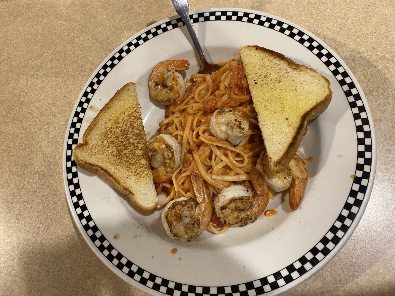 Shrimp and
        linguine and garlic toast at Mel's Diner.