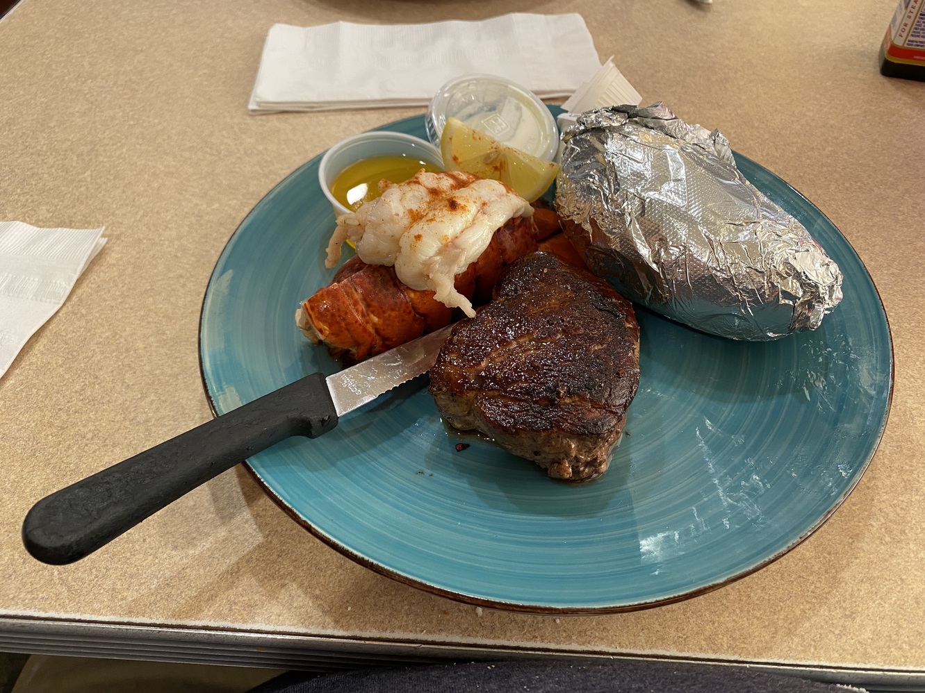 The surf & turf millionaire's corner meal with jacket
      potato.