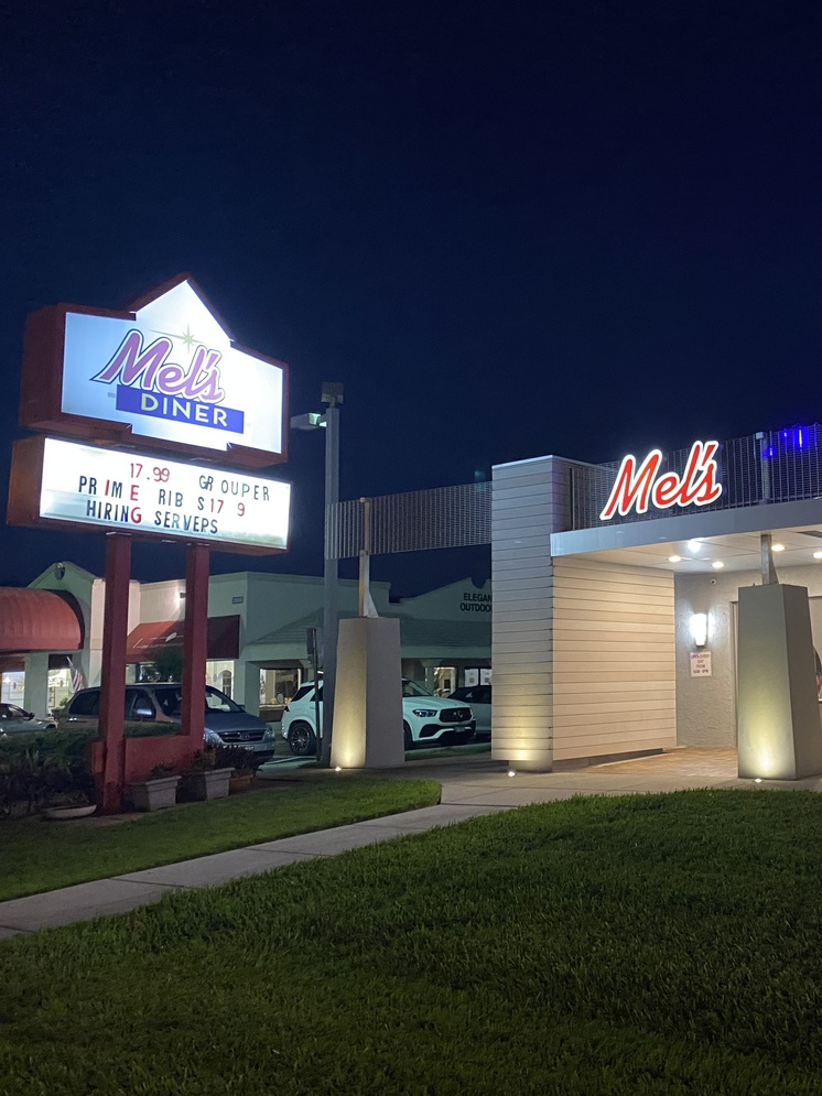 The neon signs at Mel's lights up at night.