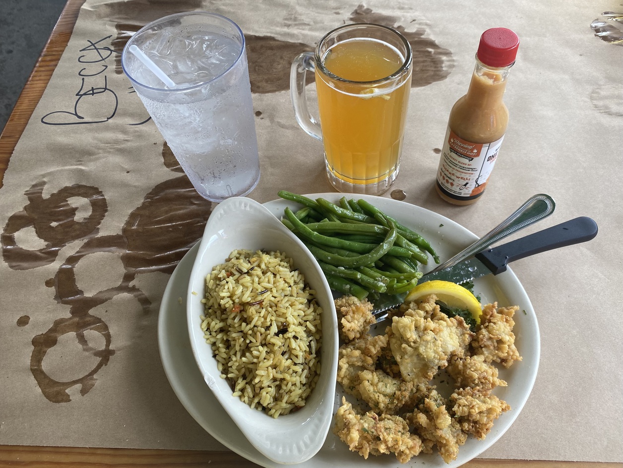 This is the fried oyster platter with wild rice and green
      beans.