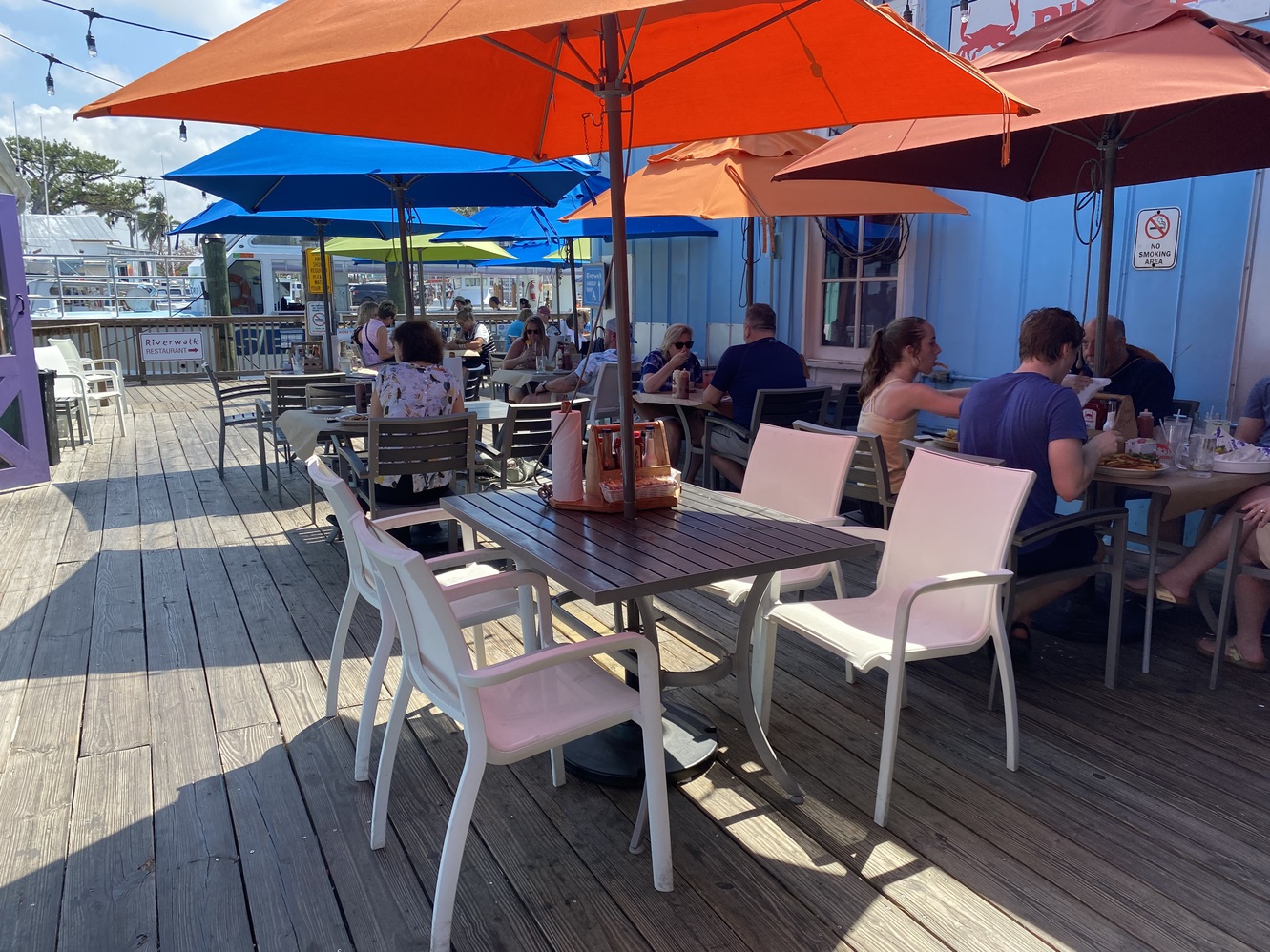 This is the patio dining at Pinchers, under beach umbrellas.