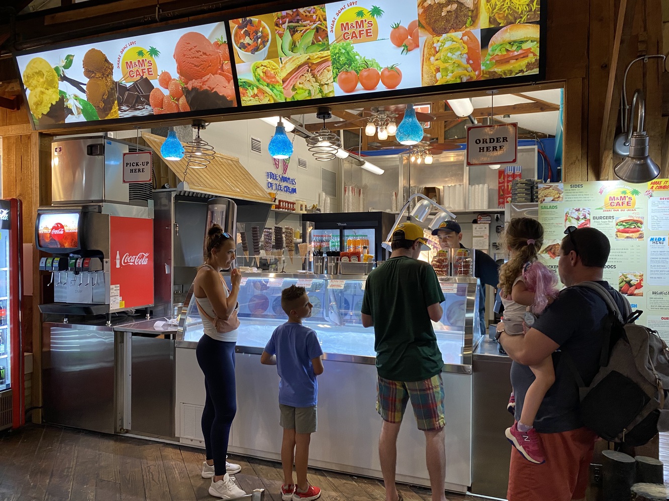 People get free samples of ice cream at M&M's Cafe.