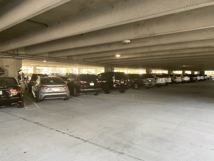 This parking
      garage has three levels, two of which are under shelter.