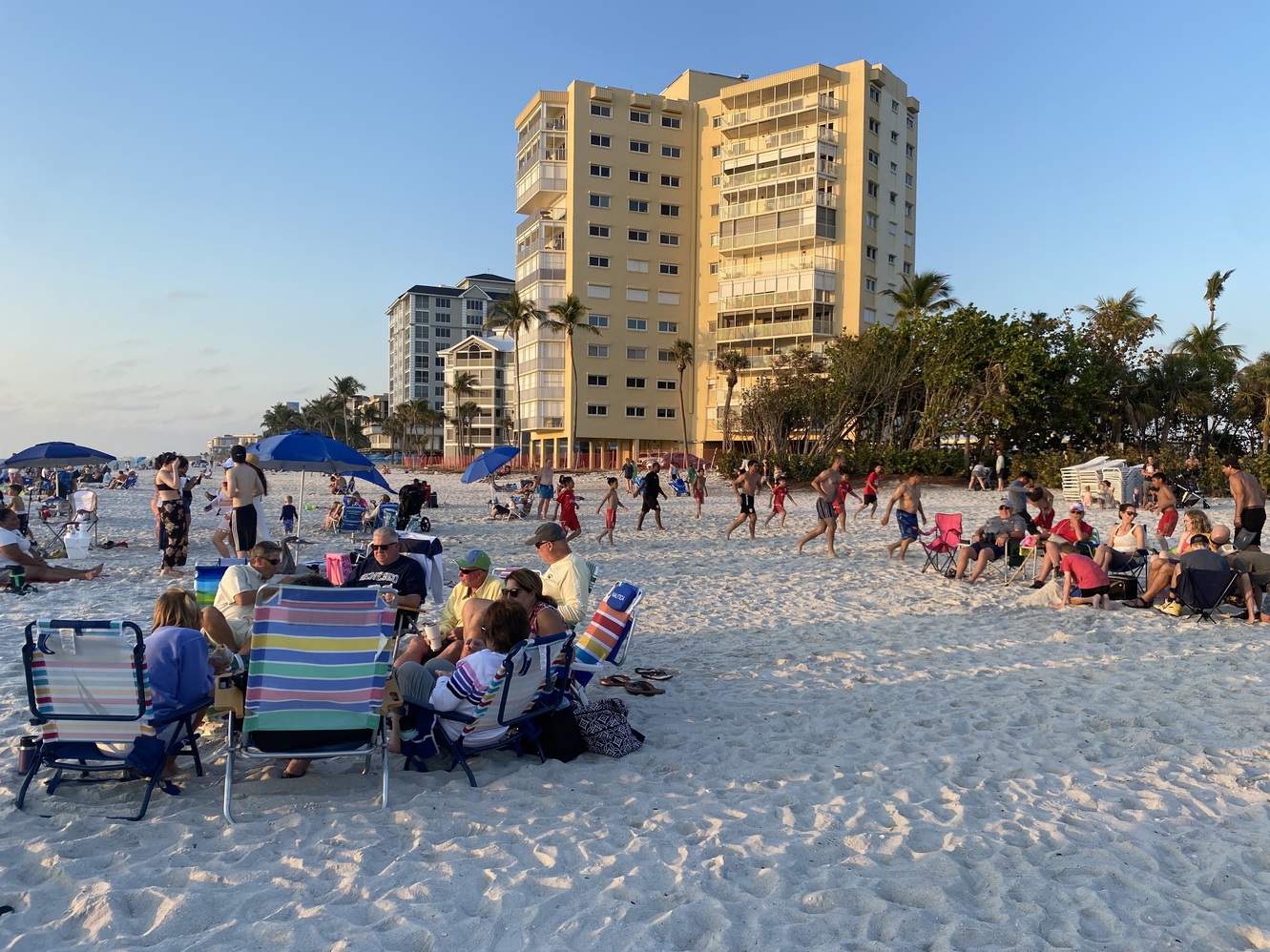 Groups of people
      are enjoying the last few moments before sunset.