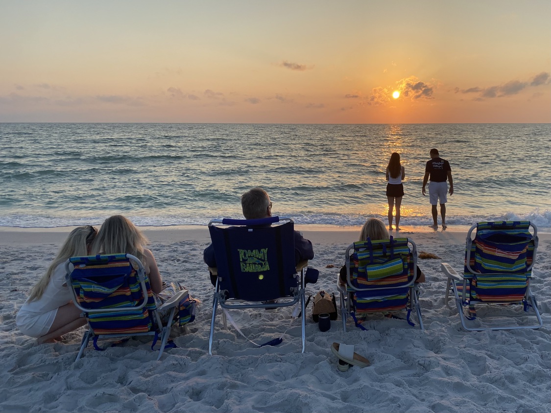 A family is
      front-and-center for this evening's sunset.